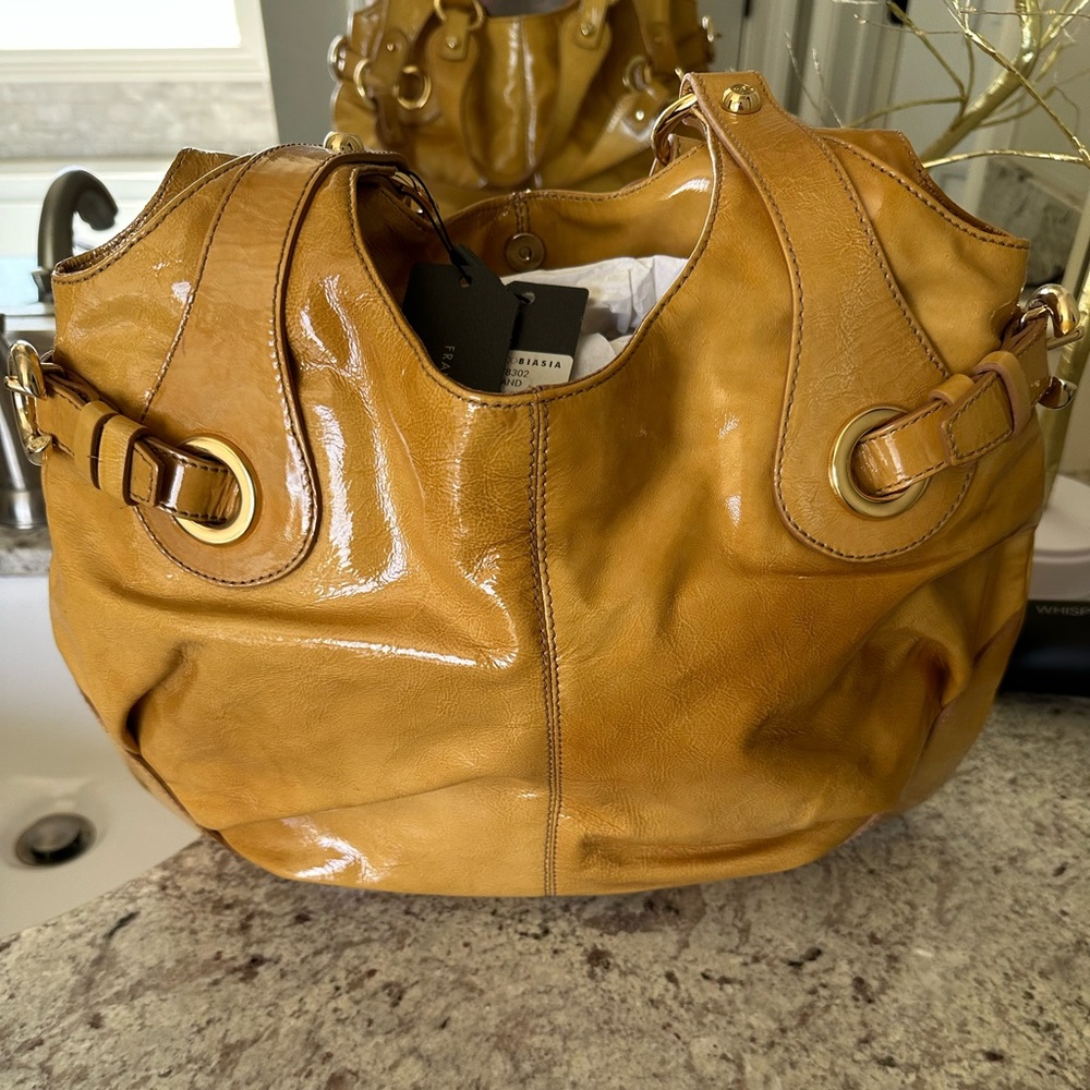 NWT; Francesco Biasia bag, model A78302, "Star Crazy.” Color called sand.